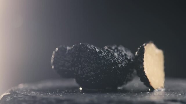 Truffle mushroom, Fresh Black Truffles on Rustic Wooden Board, Gourmet Delicacy, Luxury Culinary Ingredient, Close Up Macro Video for Restaurant and Cafe Menu
