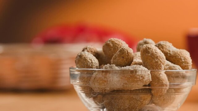 Peanuts in Salted Shell Man Cracking and Eating Salty Nuts as a Classic Bar Snack at Cafe