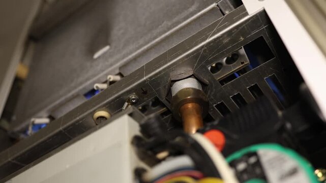 Gas boiler ignition begins as the burner lights inside the heating unit starting a controlled flame to warm the home and provide reliable indoor heating in colder weather
