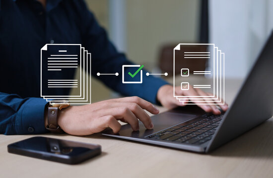 The document approval process, integrated with automated workflow management systems, facilitates legal compliance and digital business operations. Business professionals are reviewing documents.