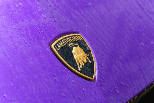 Dusseldorf, Germany - November 19 2025: A close view of a Lamborghini badge on  the hood of Urus SUV model parked outside