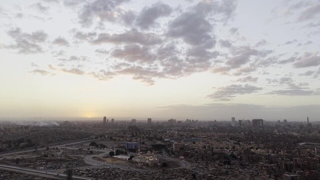 Cairo Egypt Sunset Skyline Sayyida Aisha Mosque Ascending Tilt Down High Angle Reveal DJI Drone Raw Not Color Grading Footage