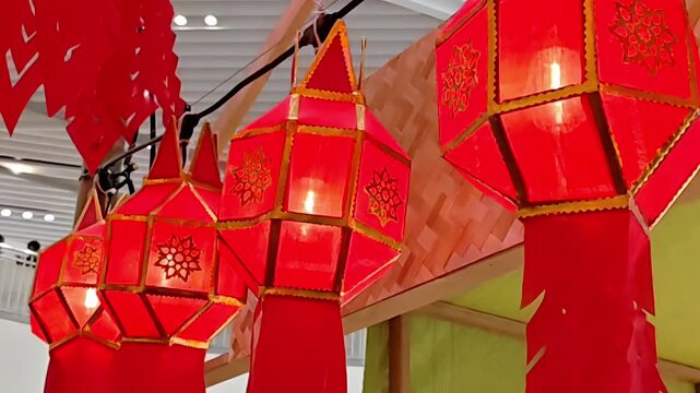 Hanging red lanna lamp lanterns on display, Thai Chiang Mai Northern Lantern Festival, Exotic Asian Culture, Religious Heritage, Decorative Craft, Slow Motion