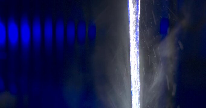 Blue and red emergency lights, abstract macro with water droplets
