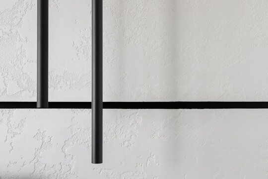 Black linear pendant lights close up