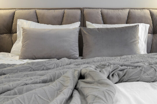 Grey pillows knitted blanket bed
