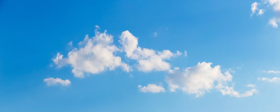 Panoramic blue sky with scattered white clouds daytime