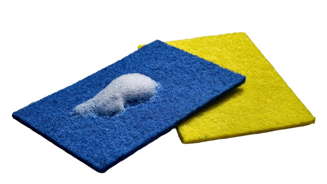Perspective angle view of blue and yellow dishwashing scouring pads with soap lather isolated on transparent background