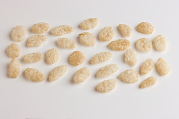 Obraz premium Rice Puffs Crisps Crispies cereal assorted close up on white