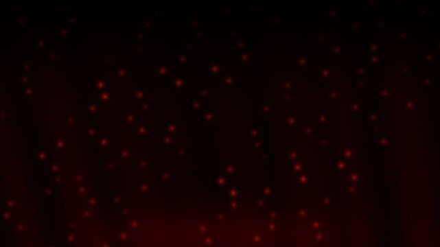 Abstract dark background with numerous small, glowing red particles resembling rising embers or sparks from a heat source.