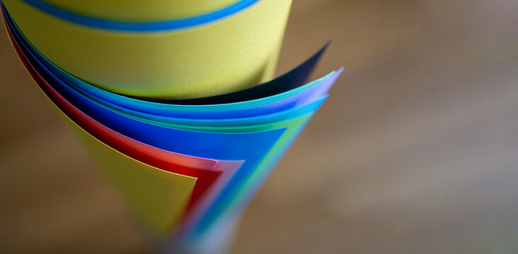 Colorful curved paper creating abstract layers and shapes