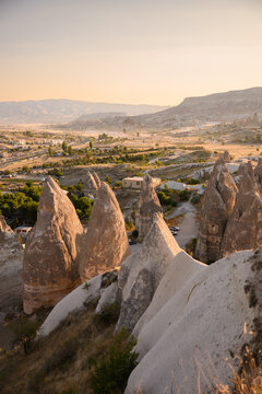 Fairy chimneys rock cones at sunset in Cappadocia Turkey for ancient heritage exploration, geological tourism and famous international landmark travel, adventure tour