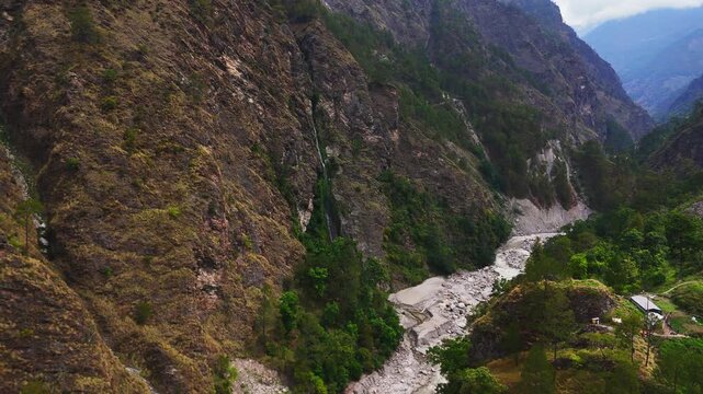 Langtang national park, Rasuwa, Nepal - 29 August 2026: Aerial view of the Trishuli river flowing through a deep mountain gorge with steep rocky cliffs and lush green vegetation.