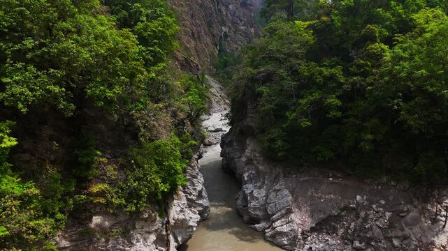 Rasuwagadhi, Nepal - 29 August 2026: Aerial view of the Trishuli river flowing through a deep rocky gorge surrounded by dense green forests.
