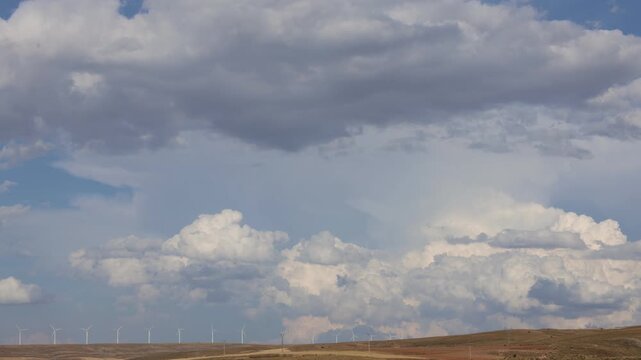 Wind Turbine Park Timelapse with Dramatic Rising Clouds in Aragon, Spain