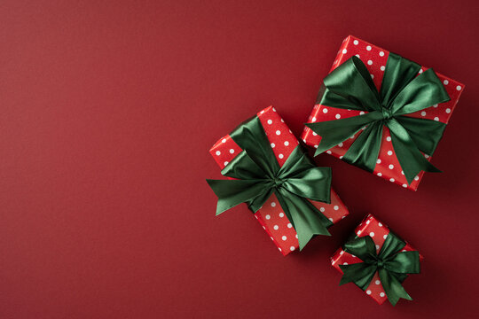 Merry Christmas wrapped presents with green bows and red polka dot paper for Happy New Year celebration