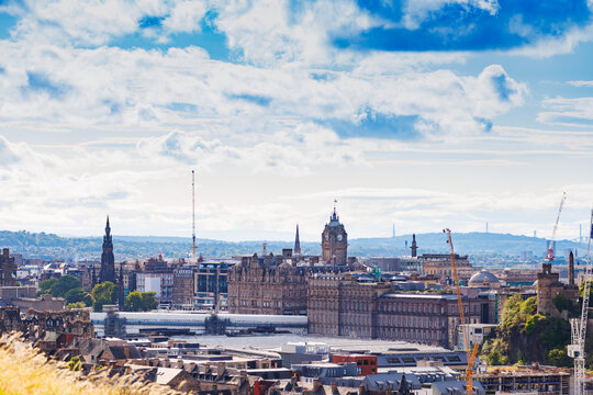 Historic city skyline views with cranes and ornate buildings