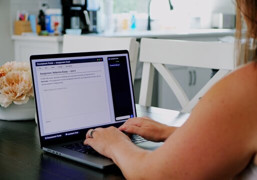 Adult college student uses artificial intelligence AI chat bot to write assignment breaking academic fair use policy cheating educational assignment