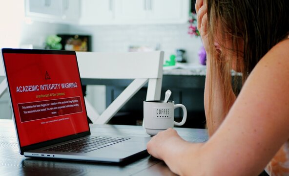 Adult college student uses artificial intelligence AI chat bot to write assignment breaking academic fair use policy cheating educational assignment