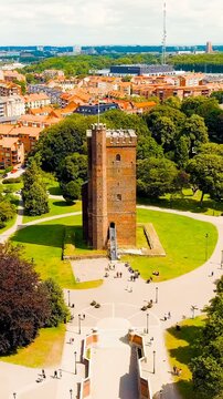 Vertical video. Helsingborg, Sweden. Karnan - Surviving 35-meter tower of a medieval castle. Summer day. Cloudy weather. Drone footage. Rich colors