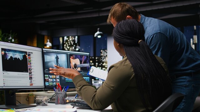 Creative editing team collaborates on a movie montage using an AI chatbot and post-production software for color grading and video content creation.