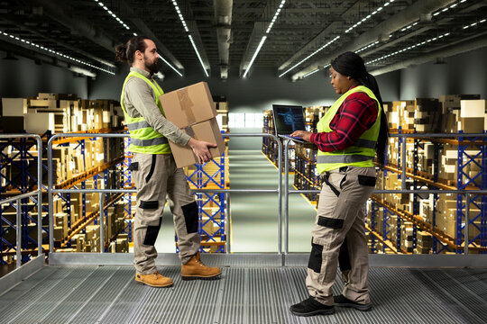Black warehouse worker using AI virtual assistant software