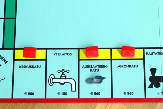 Monopoly boardgame. Classic game with street from Finland. Finnish text. The yellow streets Keskuskatu, Aleksanterinkatu and Mikonkatu.