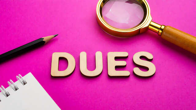 Magnifying glass inspecting bold DUES text on pink background with stationery