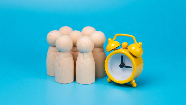 Minimalist wooden figures with alarm clock symbolizing time management and productivity