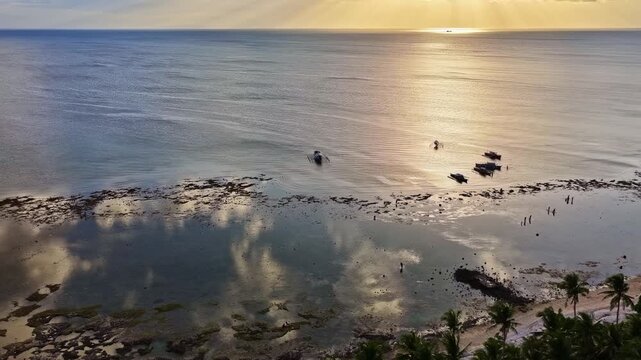 Aerial view of Mahaba Beach with small boats on calm waters during golden hour in Eastern Visayas, Philippines.