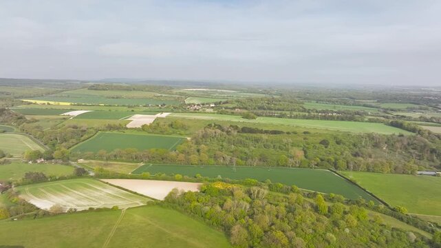 Fields and Farms over Halnaker Hill and the Windmill Trail from a drone, Boxgrove Village, West Sussex, England