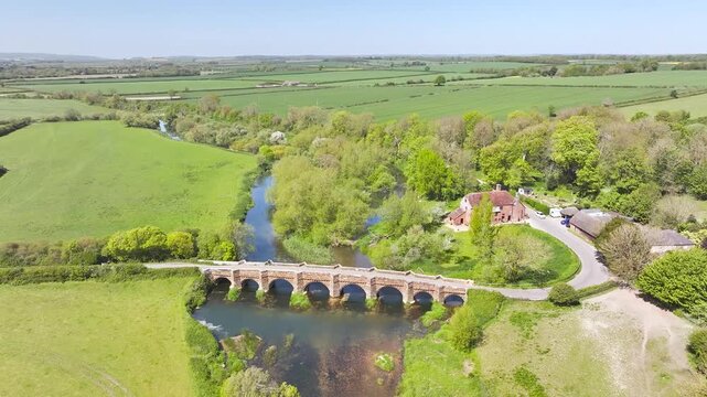 White Mill and Old Bridge over River Stour from a drone, Sturminster Marshall, Dorset, England