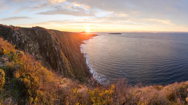 Epic sunrise golden light on the Waitpinga Cliffs at dawn over the ocean and horizon on the Fleurieu Peninsula in South Australia