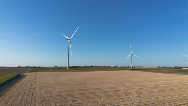 Clear blue sky above vast, open field