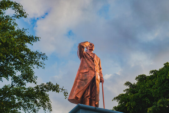 Bronze statue of General Sudirman against a cloudy sky