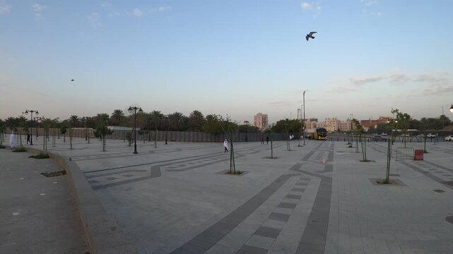 Scenic view of Masjid Quba and its large courtyard at sunrise in Medina.