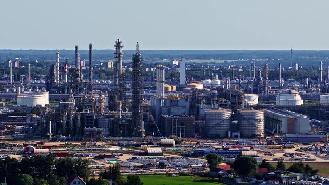 Aerial view of the ORLEN Plock Production Plant featuring large storage tanks, distillation towers, and industrial infrastructure in Plock, Wojewodztwo mazowieckie, Poland.