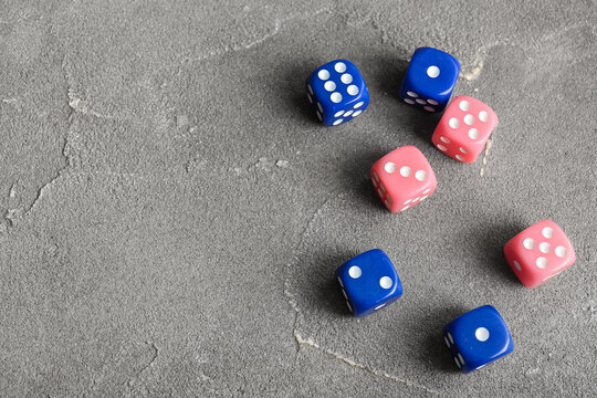 Different dices on grey background