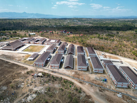 Aerial view of Sekolah Rakyat in Kupang, East Nusa Tenggara, Indonesia, with school buildings, dry land, and rural hills.