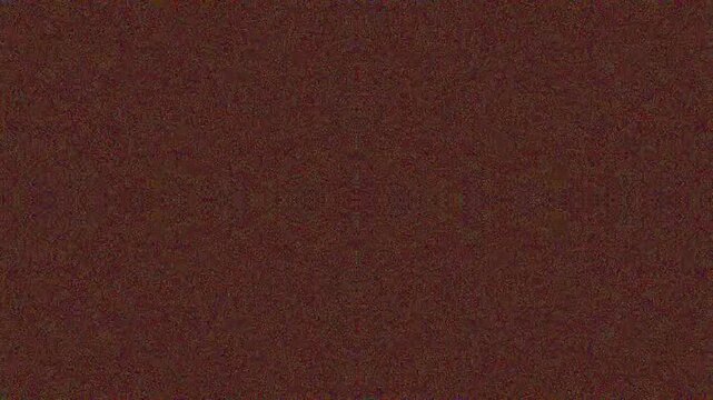 Close-up of textured brown fabric with subtle pattern