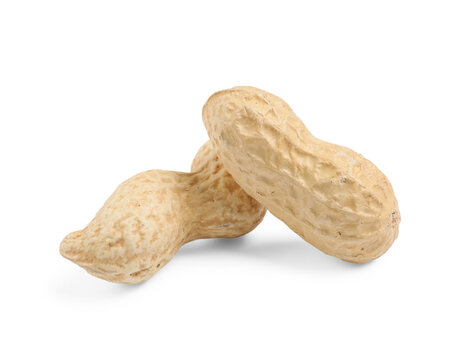 Unpeeled peanuts on white background