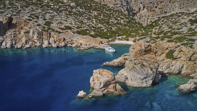 Palatia Beach, Palatia, Clear blue water in a bay with boat and surrounding cliffs, boat tour Saria, Saria Island, Karpathos, Dodecanese, Greek Islands, Greece