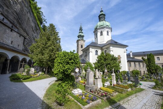 Graves at St. Peter Cemetery with St. Peter Collegiate Church, Old Town, Salzburg, Austria