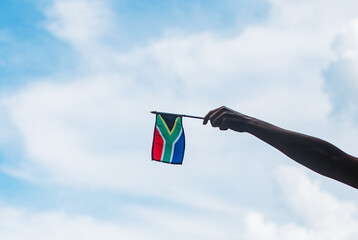 hand holding south african flag