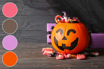 Naklejka premium Halloween celebration and trick or treat concept, jack o lantern pumpkin bucket filled with assorted gummy candies on a dark rustic wooden background