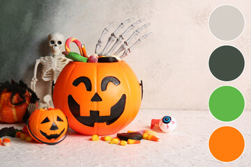 Naklejka premium Halloween celebration and trick or treat tradition, plastic pumpkin buckets filled with candy and skeleton hand prop on a textured light background