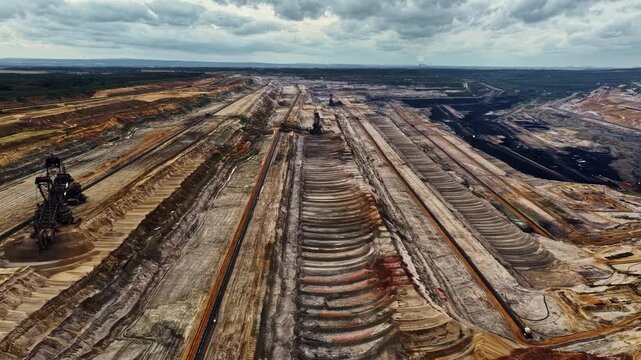 Aerial view of the massive Tagebau Hambach open-pit coal mine featuring large bucket-wheel excavators and terraced industrial landscape in Elsdorf, Nordrhein-Westfalen, Germany.