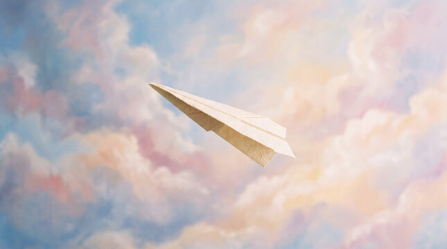Paper airplane flying through a soft pastel sunset sky with fluffy clouds