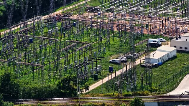 Aerial view of ZE PAK SA Elektrownia Patnow power station with electrical infrastructure, transformers, and transmission towers in Konin, Wielkopolskie, Poland.