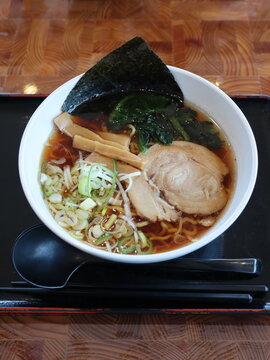 Top view of soy sauce ramen with chashu pork and nori seaweed